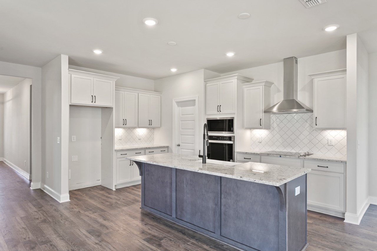 1033 Riverview Run Madison, TN 37115 - Photo 5 of 23 a kitchen with kitchen island a sink stainless steel appliances and cabinets