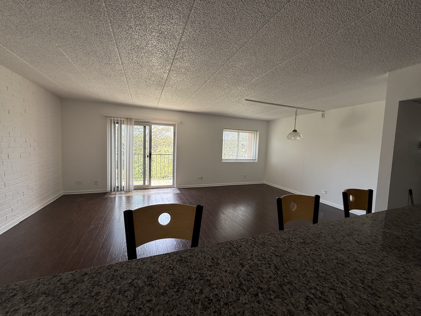3220 Sanders Road, Unit 3B Northbrook, IL 60062 - Photo 10 of 13 a view of an empty room with a window