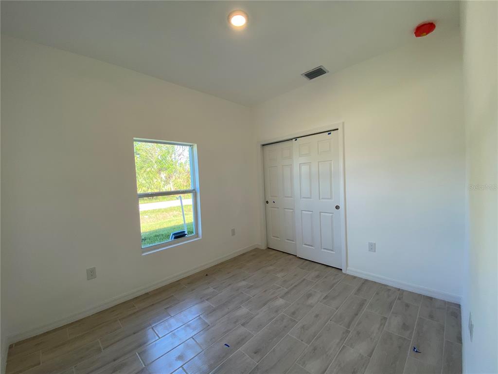13216 Keystone Boulevard, Unit 13216 Port Charlotte, FL 33981 - Photo 5 of 23 an empty room with a window