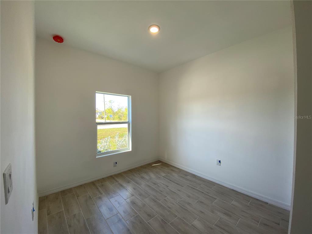 13216 Keystone Boulevard, Unit 13216 Port Charlotte, FL 33981 - Photo 8 of 23 an empty room with a window