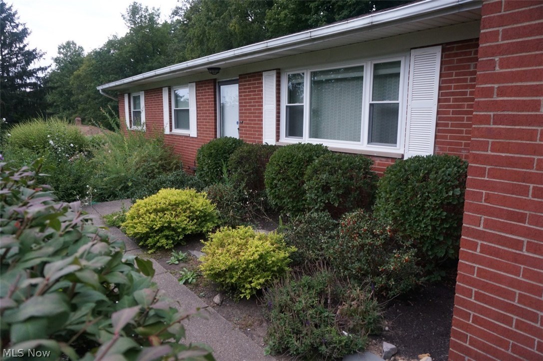 1087 Broadmoor Road Macedonia, OH 44056 - Photo 2 of 35 Your inviting walkway with gardens waiting for your touch.