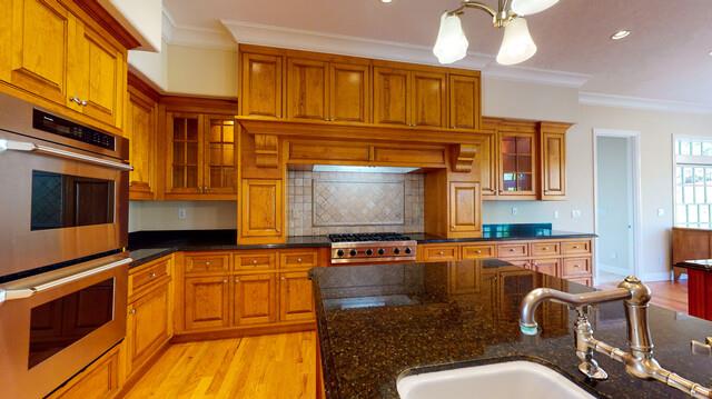 9560 Vía Del Oro Gilroy, CA 95020 - Photo 17 of 65 a living room with stainless steel appliances kitchen island granite countertop a stove and a microwave