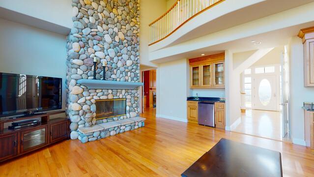 9560 Vía Del Oro Gilroy, CA 95020 - Photo 20 of 65 a living room with a fireplace furniture and a flat screen tv