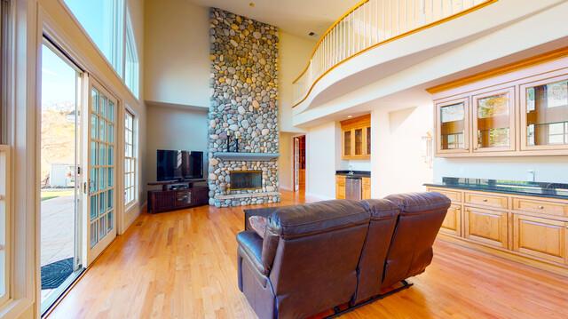 9560 Vía Del Oro Gilroy, CA 95020 - Photo 22 of 65 a living room with furniture a fireplace and a flat screen tv