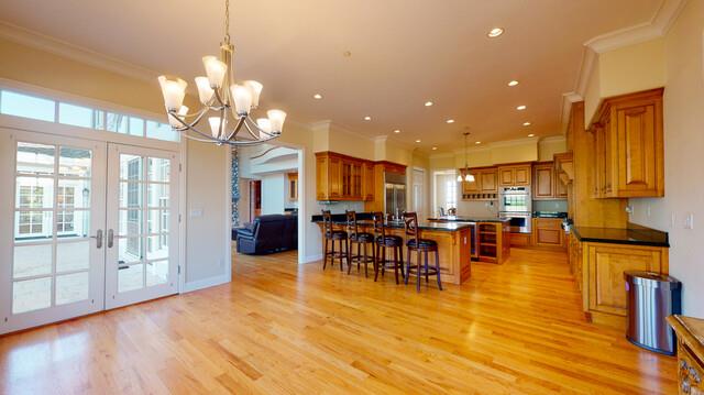 9560 Vía Del Oro Gilroy, CA 95020 - Photo 23 of 65 a view of a dining room with furniture a chandelier and wooden floor