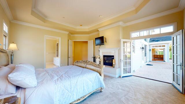 9560 Vía Del Oro Gilroy, CA 95020 - Photo 33 of 65 a spacious bedroom with a bed and a fireplace