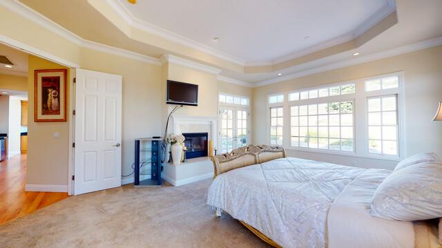 9560 Vía Del Oro Gilroy, CA 95020 - Photo 34 of 65 a spacious bedroom with a bed and a fireplace