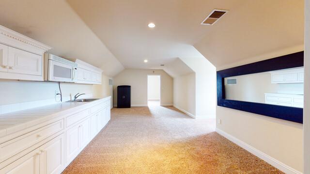 9560 Vía Del Oro Gilroy, CA 95020 - Photo 58 of 65 a large kitchen with stainless steel appliances a large counter top a stove and a refrigerator