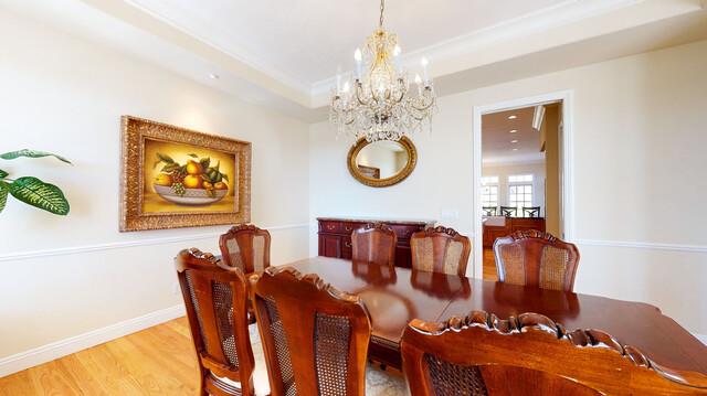 9560 Vía Del Oro Gilroy, CA 95020 - Photo 10 of 65 a view of a dining room with furniture and chandelier