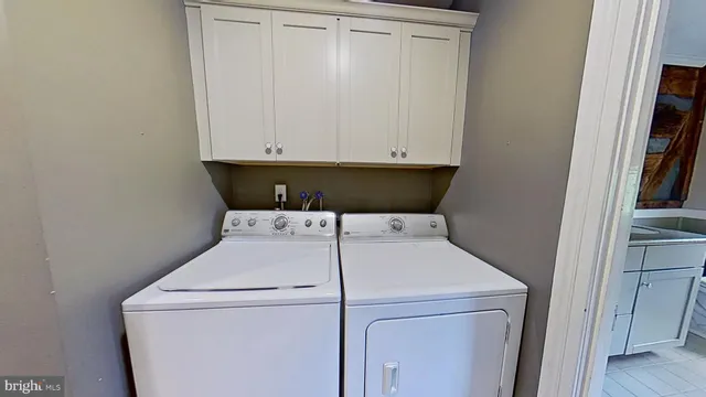 a view of kitchen with cabinets and wooden floor