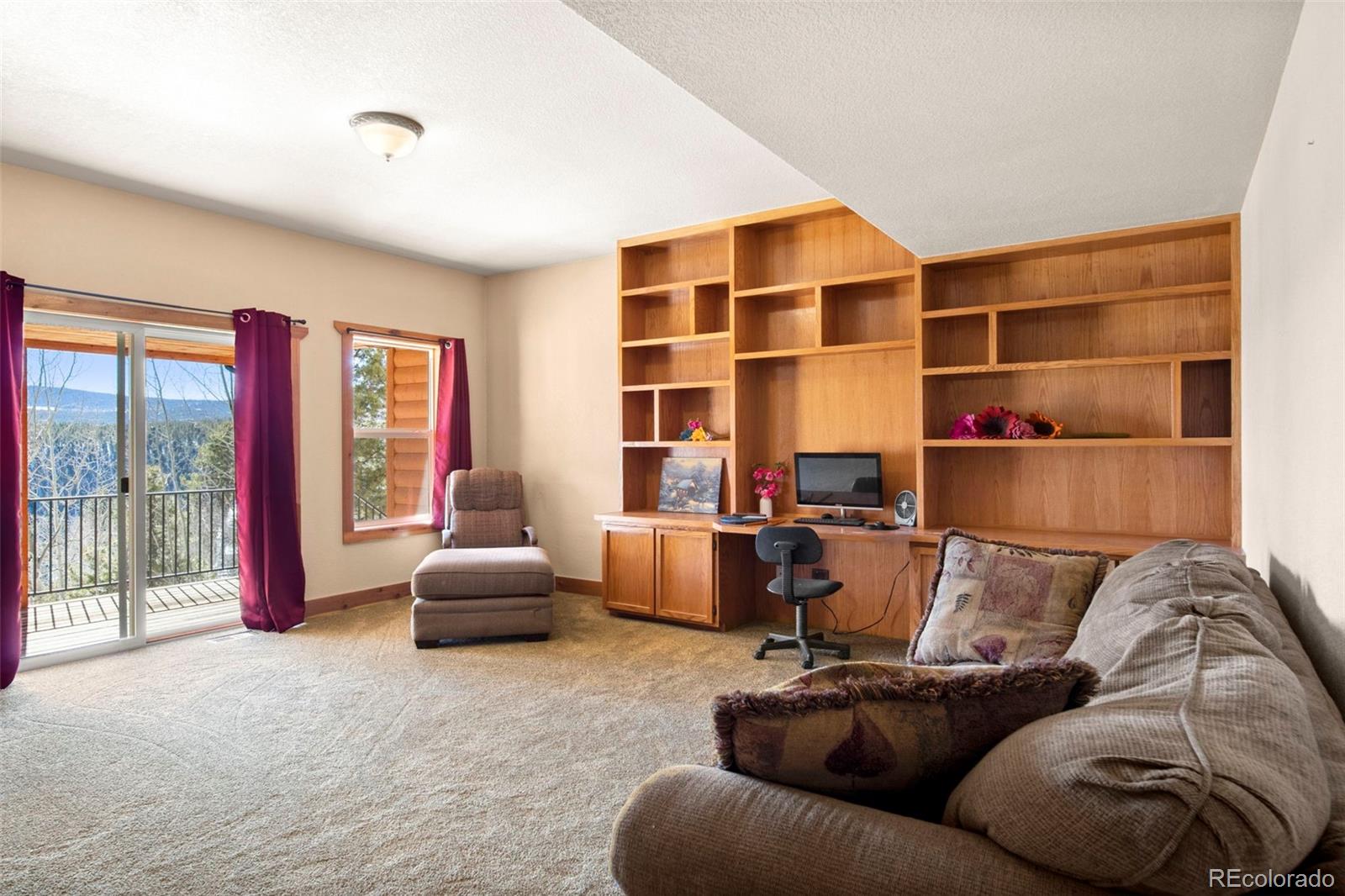 412 Evergreen Road Black Hawk, CO 80422 - Photo 8 of 48 a living room with furniture and a large window