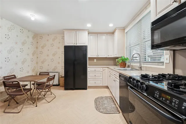 a bathroom with a sink a toilet and shower curtain