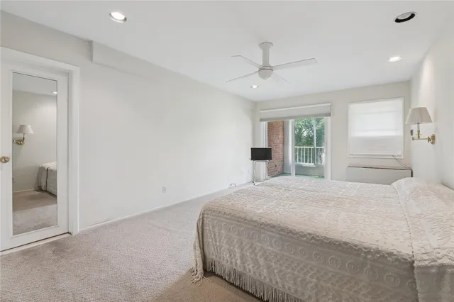 a large white bed in a white room