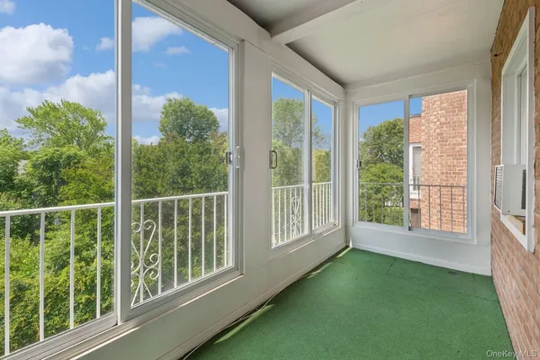 a view of a room that has a large window