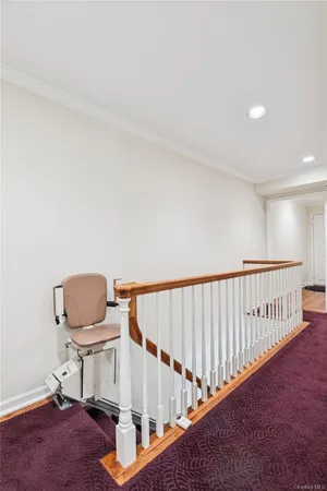 a view of staircase with a rug