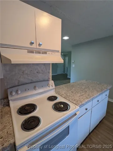 a view of a hallway view with wooden floor