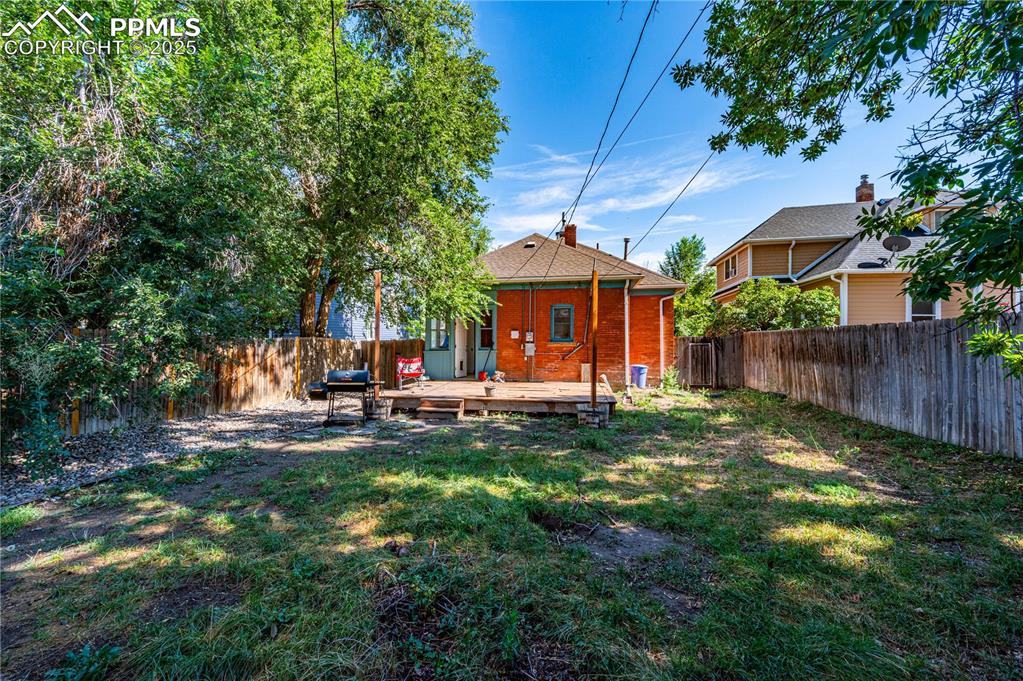 609 Rudd Avenue Canon City, CO 81212 - Photo 17 of 20 a view of a house with backyard sitting area and garden