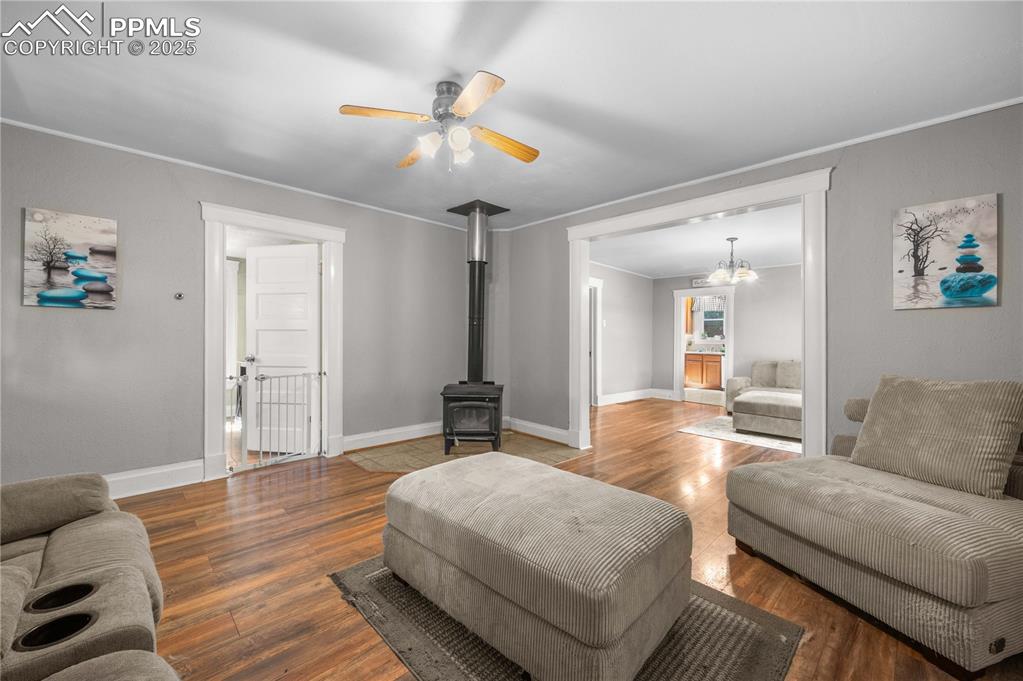 609 Rudd Avenue Canon City, CO 81212 - Photo 4 of 20 a living room with furniture and a chandelier