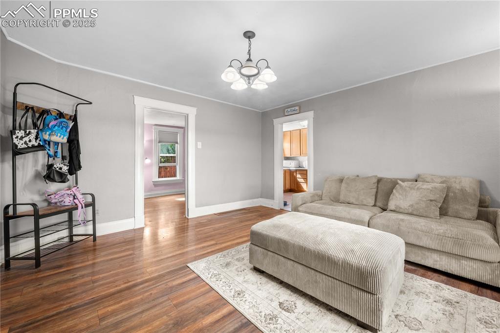 609 Rudd Avenue Canon City, CO 81212 - Photo 5 of 20 a living room with furniture and a chandelier