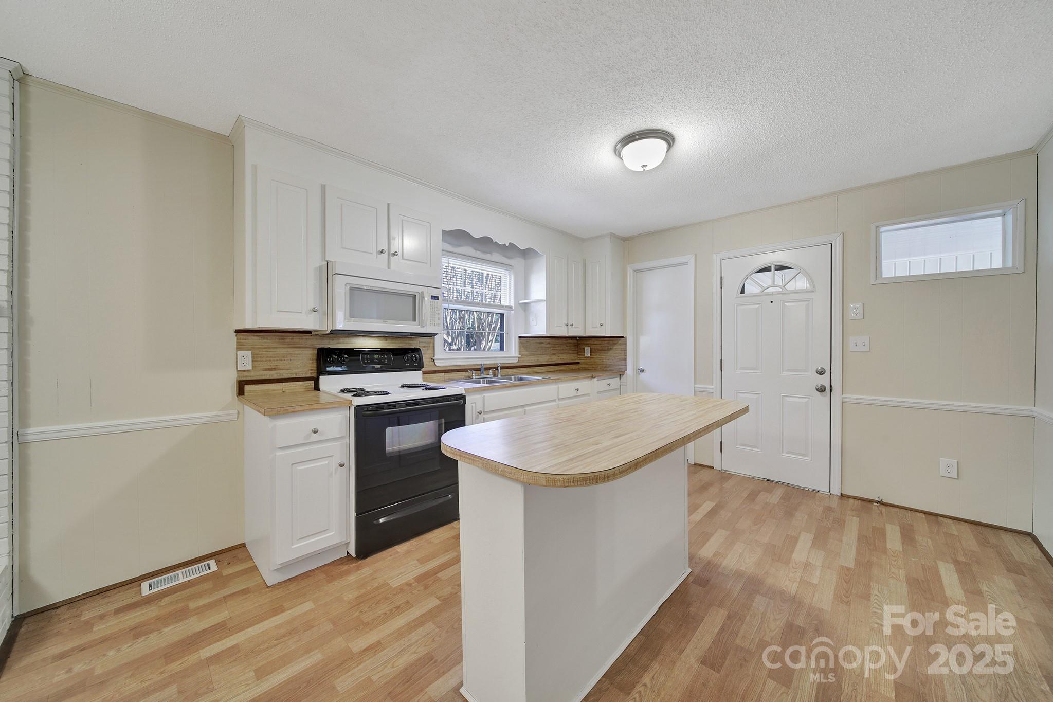 157 Holiday Road Lancaster, SC 29720 - Photo 13 of 31 a kitchen with stainless steel appliances a white stove top oven and a refrigerator