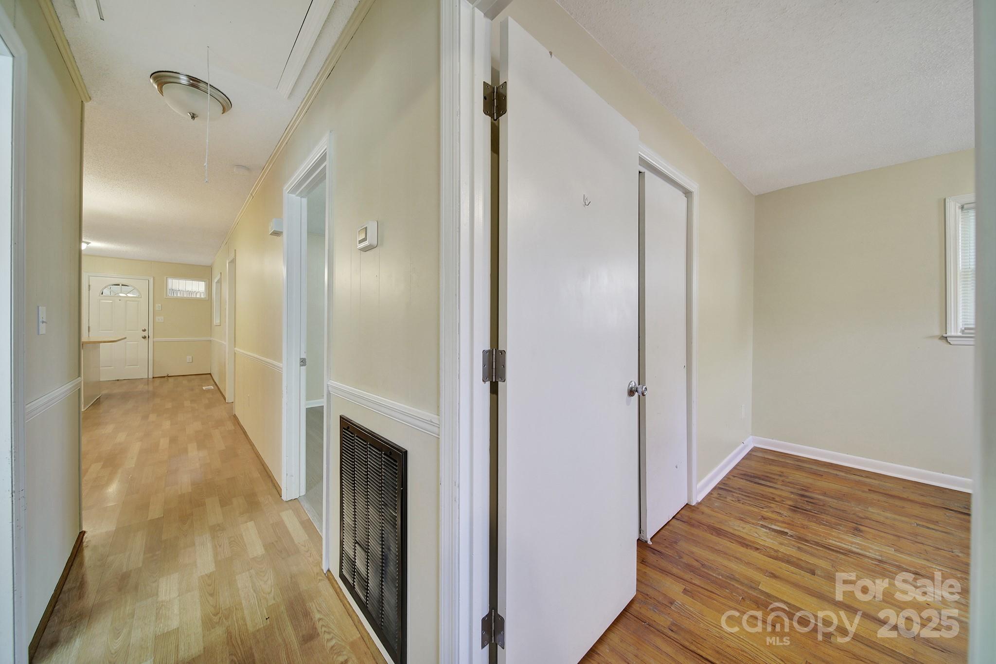 157 Holiday Road Lancaster, SC 29720 - Photo 18 of 31 a view of a hallway with wooden floor and staircase