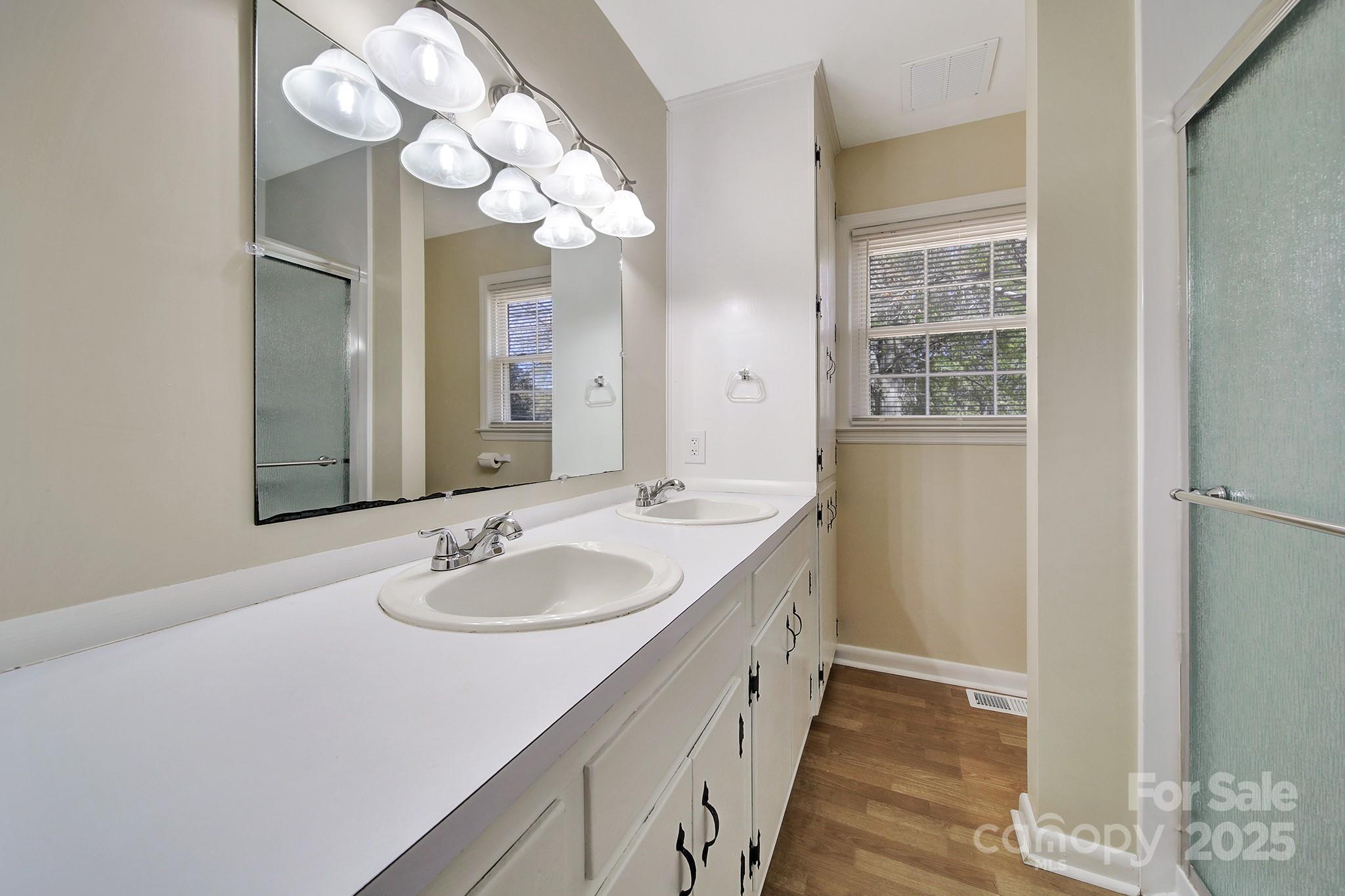 157 Holiday Road Lancaster, SC 29720 - Photo 23 of 31 a bathroom with a granite countertop sink and a mirror