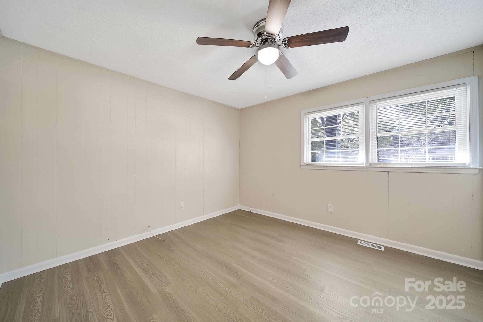 157 Holiday Road Lancaster, SC 29720 - Photo 25 of 31 wooden floor in an empty room with a window