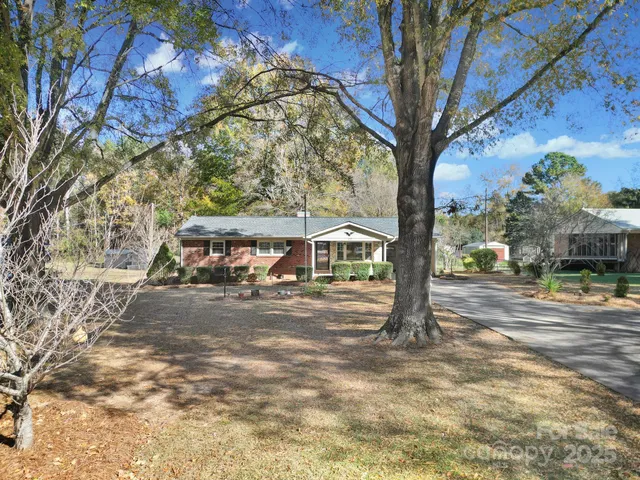 a view of a trees in front of a house