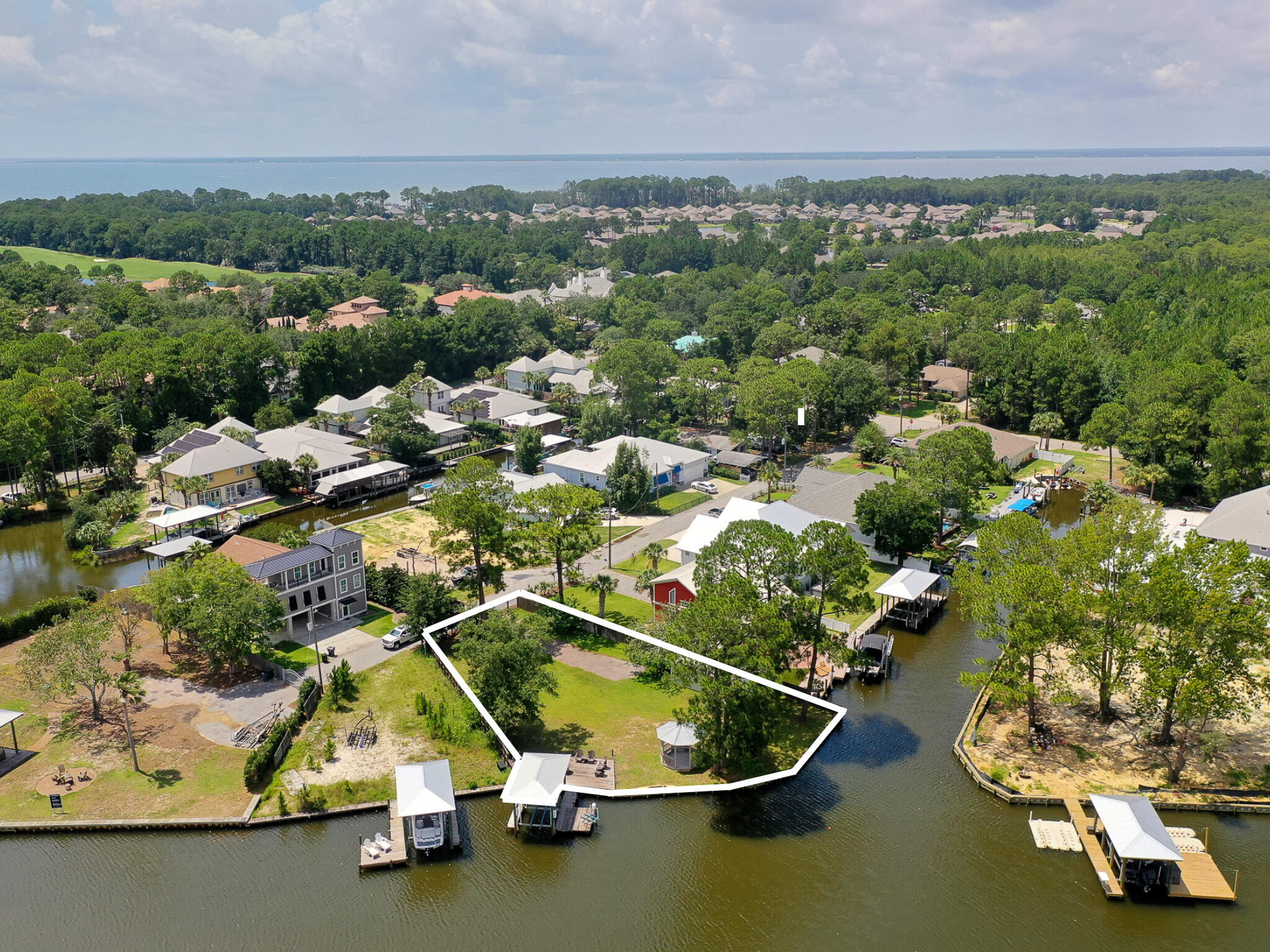 83 Anchor Lane Santa Rosa Beach, FL 32459 - Photo 4 of 5 an aerial view of a house with a yard and lake view