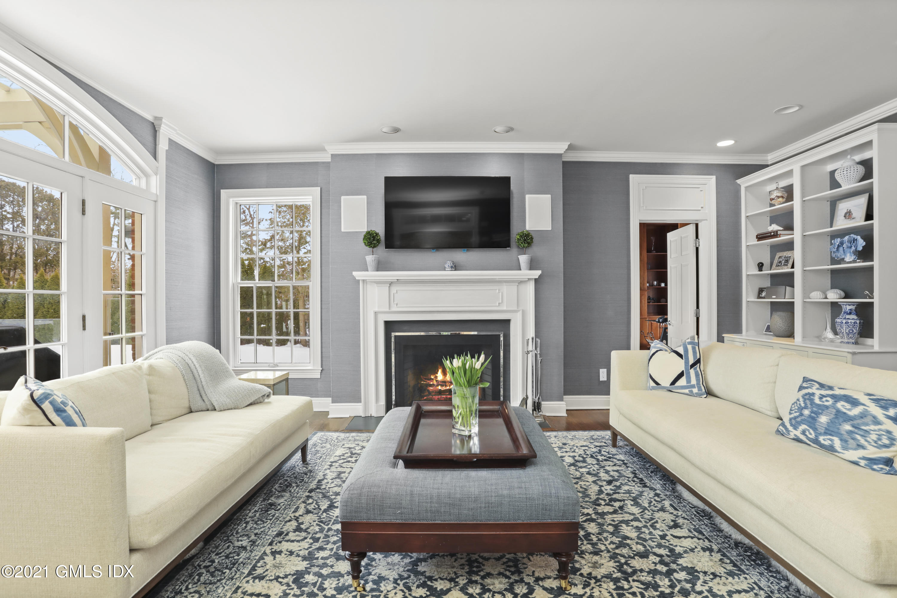 41 Dawn Harbor Lane Riverside, CT 06878 - Photo 11 of 33 a living room with furniture fireplace and flat screen tv