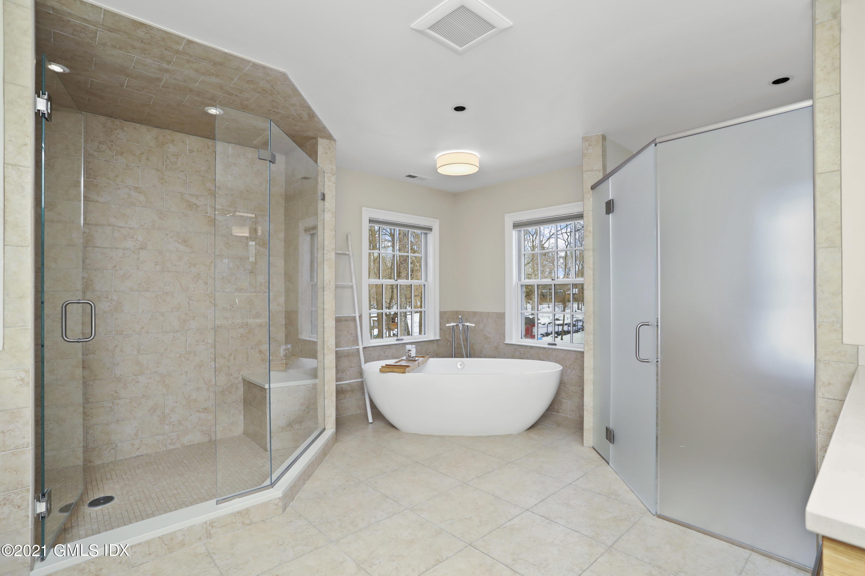 41 Dawn Harbor Lane Riverside, CT 06878 - Photo 16 of 33 a spacious bathroom with a bathtub and shower