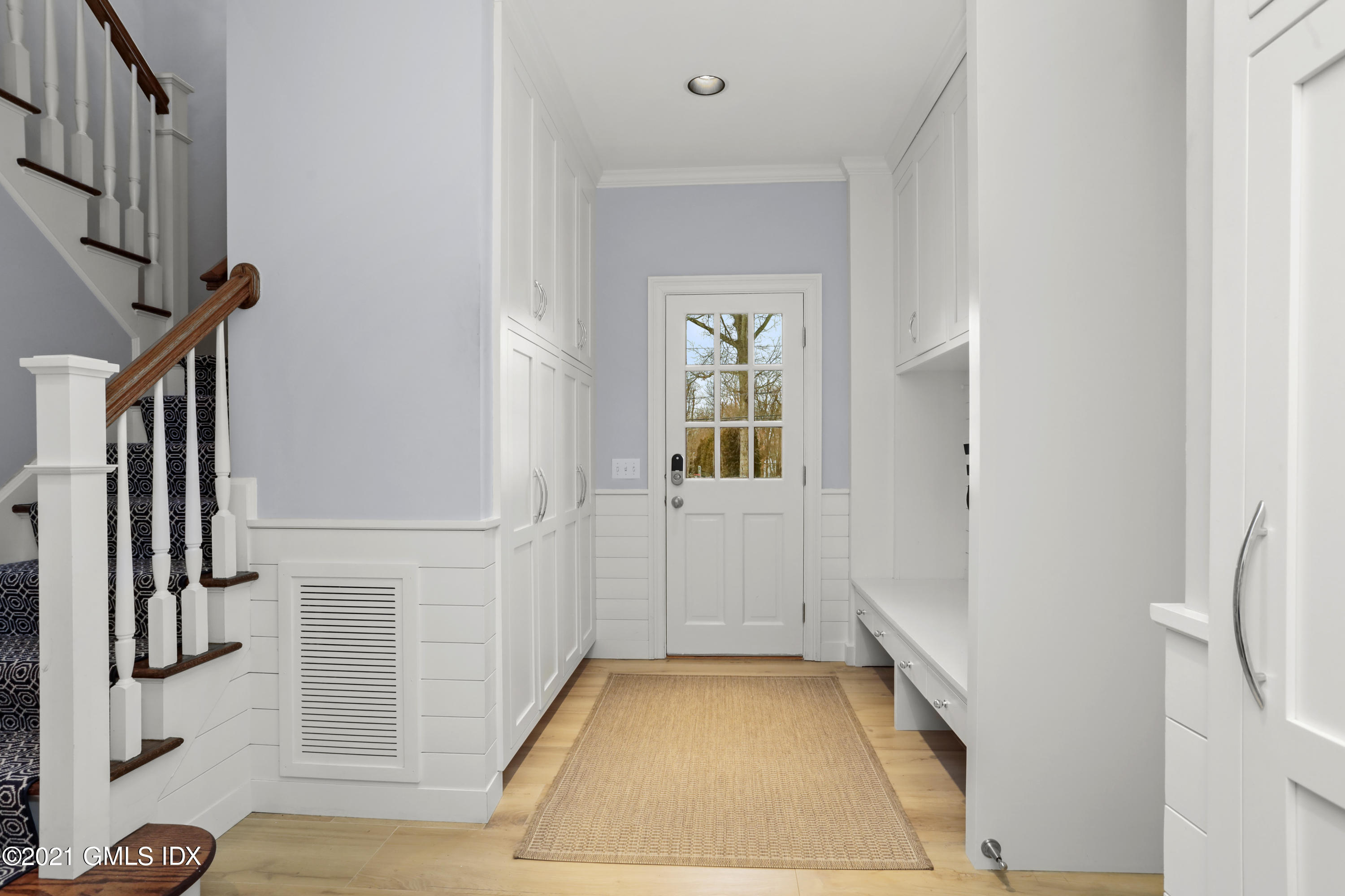 41 Dawn Harbor Lane Riverside, CT 06878 - Photo 25 of 33 a view of an entryway with wooden floor and a livingroom