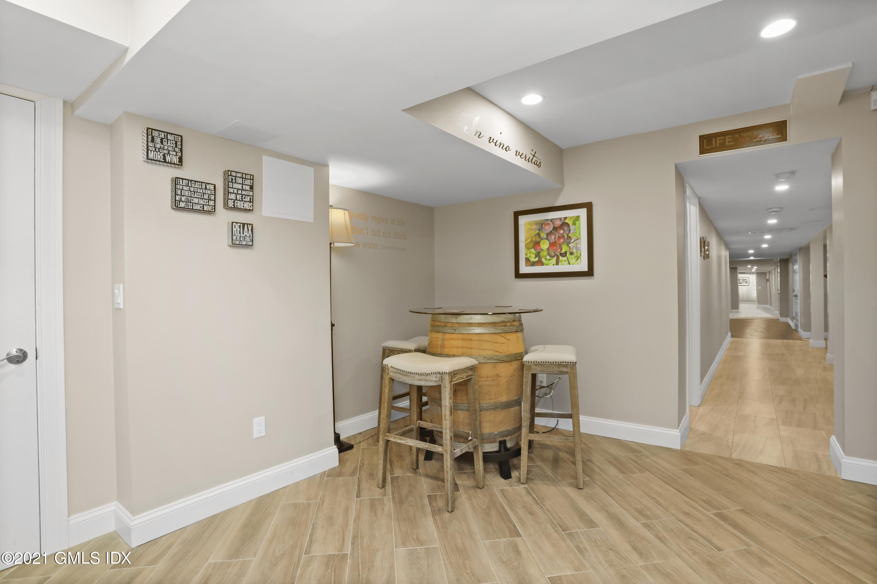 41 Dawn Harbor Lane Riverside, CT 06878 - Photo 27 of 33 a workspace with furniture and wooden floor