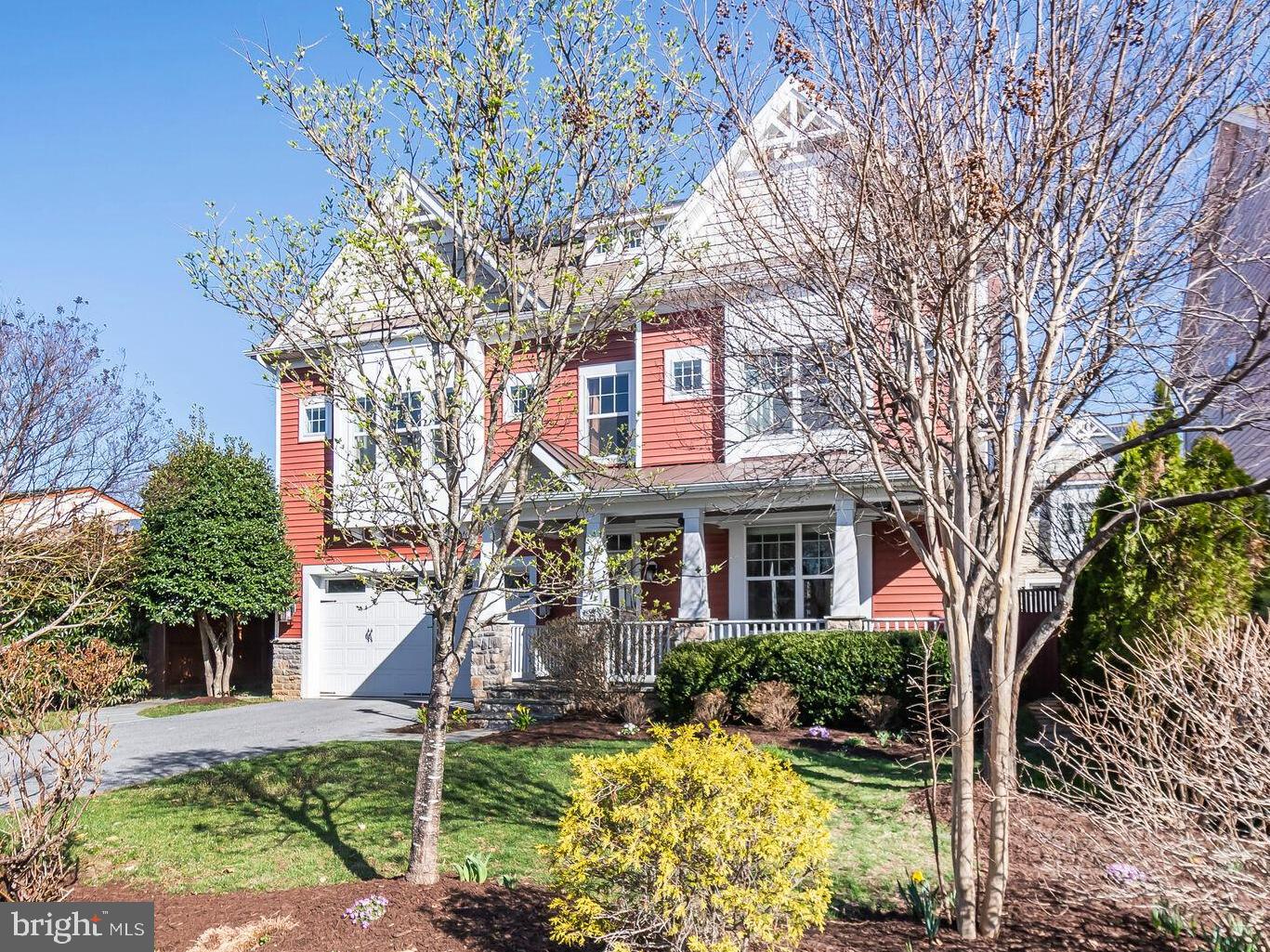 a front view of a house with a yard table and chairs