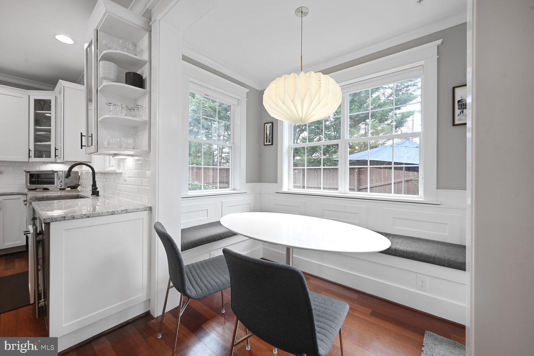 2107 Ellis Street Silver Spring, MD 20910 - Photo 18 of 63 a view of a dining room with furniture window and wooden floor