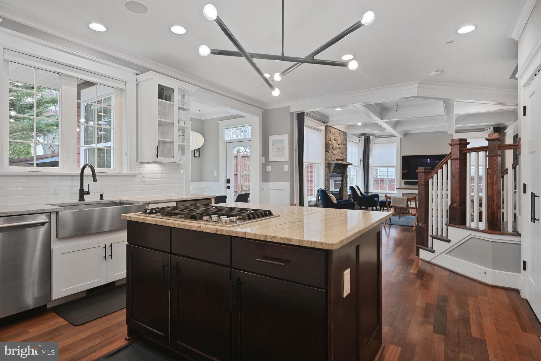 2107 Ellis Street Silver Spring, MD 20910 - Photo 21 of 63 a kitchen with stainless steel appliances granite countertop a sink a stove and a wooden floors