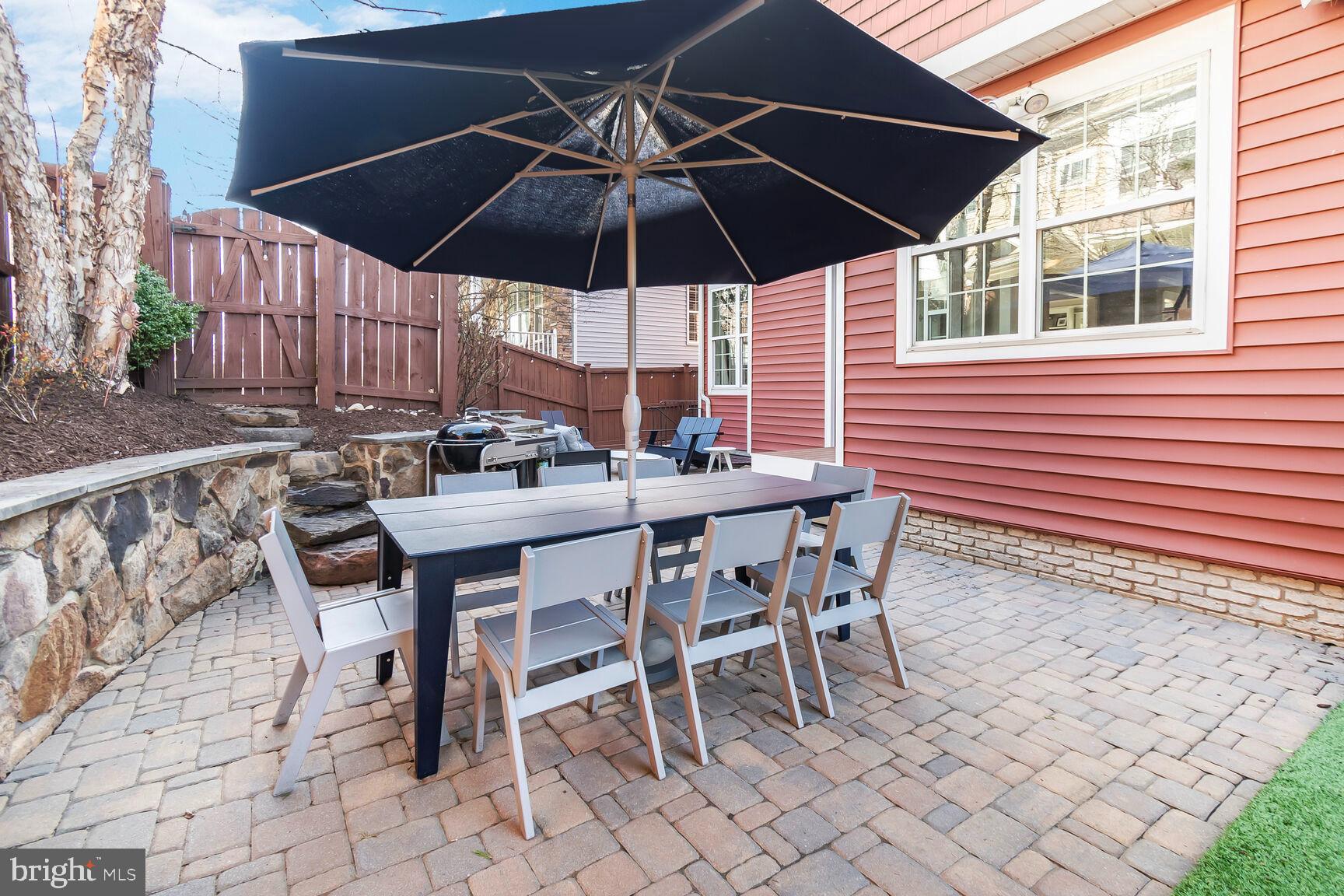 2107 Ellis Street Silver Spring, MD 20910 - Photo 23 of 63 a table and chairs in patio with a umbrella