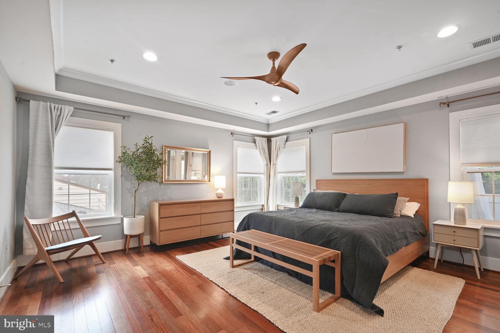 2107 Ellis Street Silver Spring, MD 20910 - Photo 32 of 63 a bedroom with a bed and wooden floor