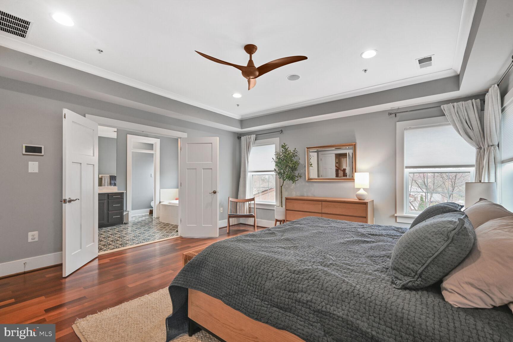 2107 Ellis Street Silver Spring, MD 20910 - Photo 35 of 63 a bedroom with a bed and wooden floor