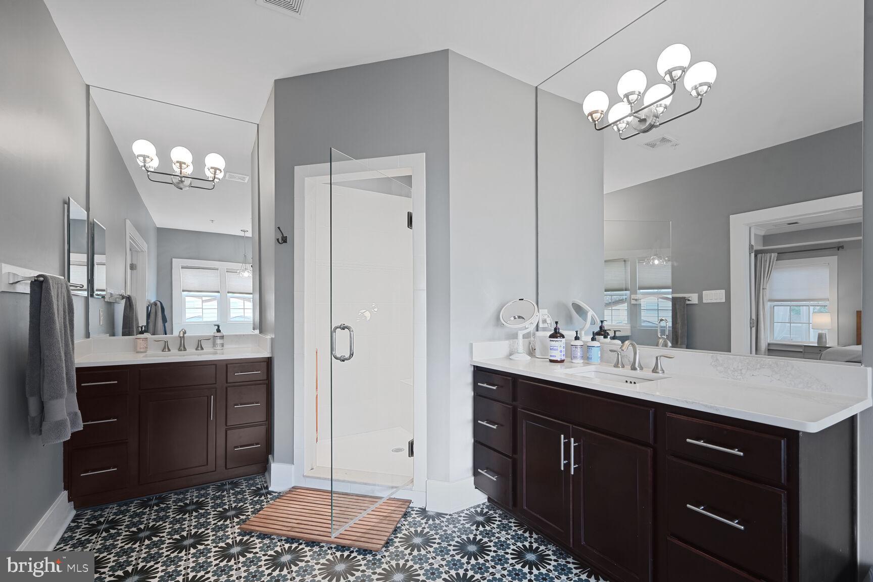 2107 Ellis Street Silver Spring, MD 20910 - Photo 39 of 63 a spacious bathroom with a double vanity sink a mirror and a shower