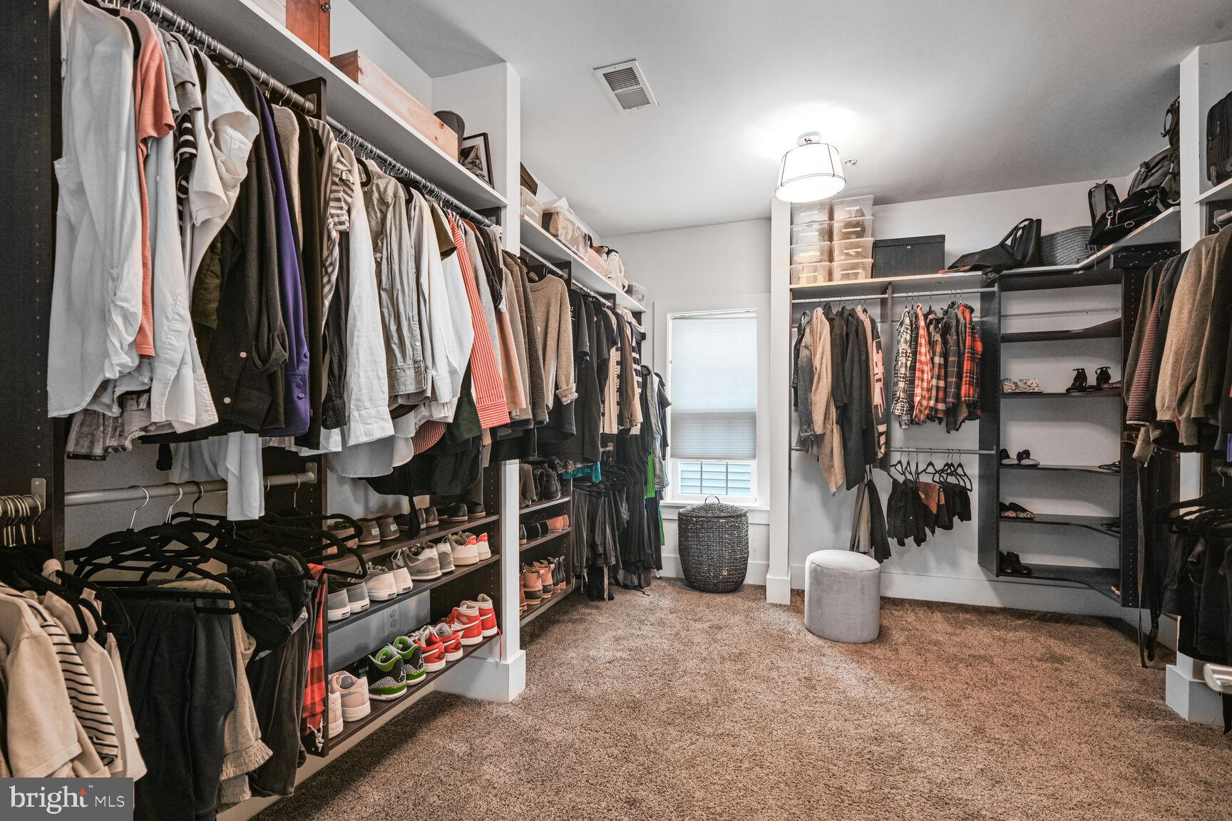 2107 Ellis Street Silver Spring, MD 20910 - Photo 43 of 63 a view of walk in closet with clothes and shoes