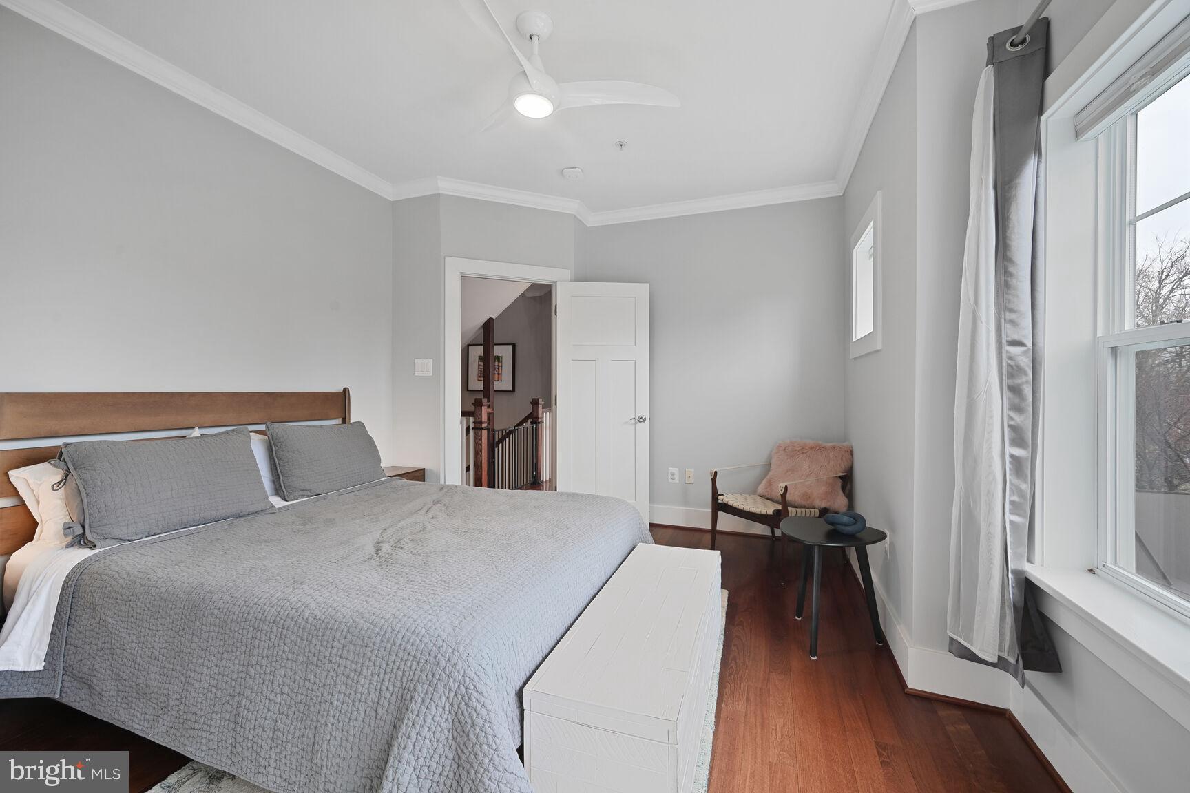 2107 Ellis Street Silver Spring, MD 20910 - Photo 45 of 63 a bed room with a bed and a chair