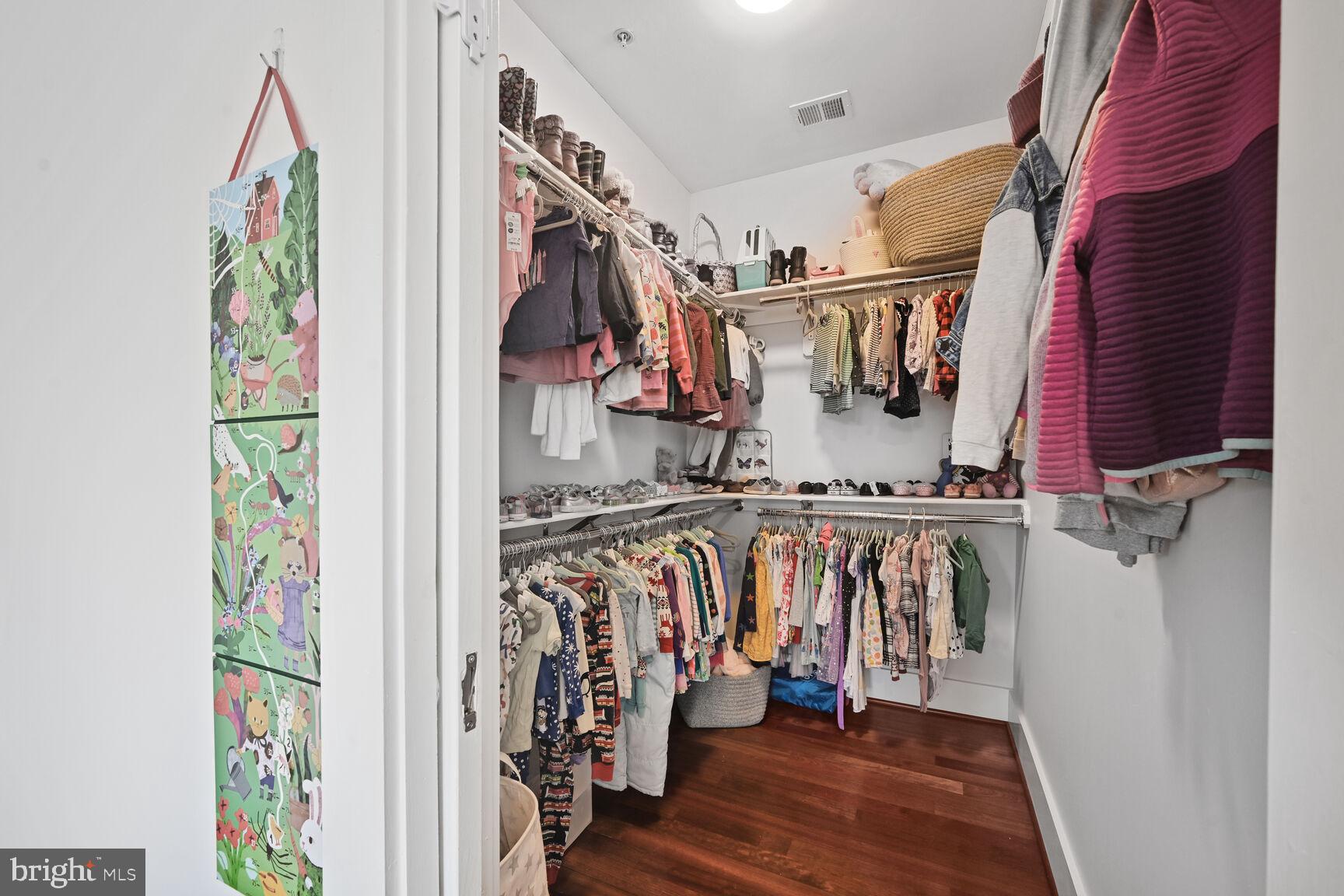 2107 Ellis Street Silver Spring, MD 20910 - Photo 49 of 63 a view of walk in closet with clothes