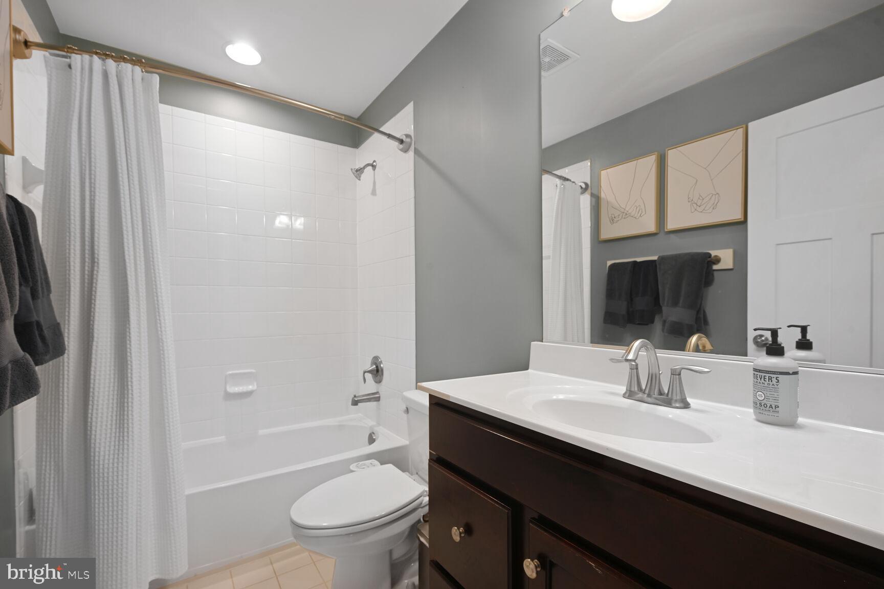 2107 Ellis Street Silver Spring, MD 20910 - Photo 56 of 63 a bathroom with a granite countertop sink toilet and shower