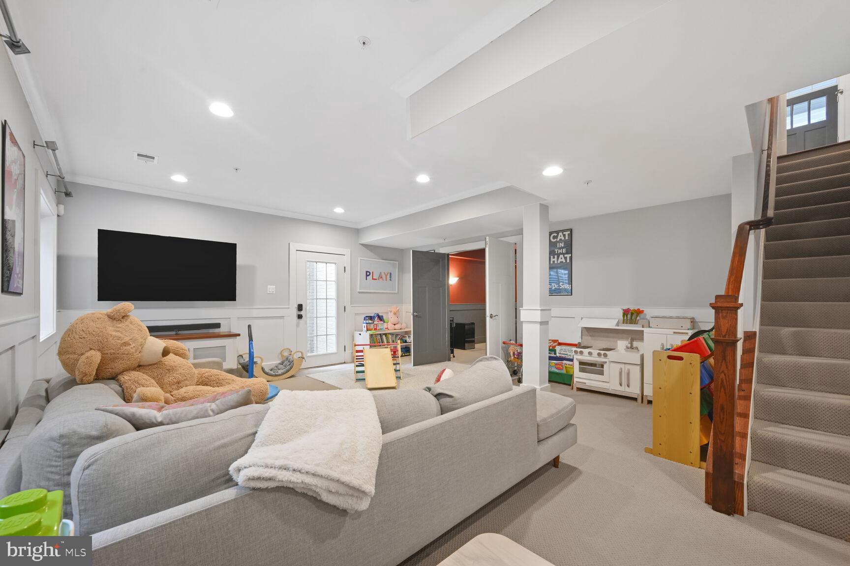 2107 Ellis Street Silver Spring, MD 20910 - Photo 58 of 63 a living room with furniture and a flat screen tv