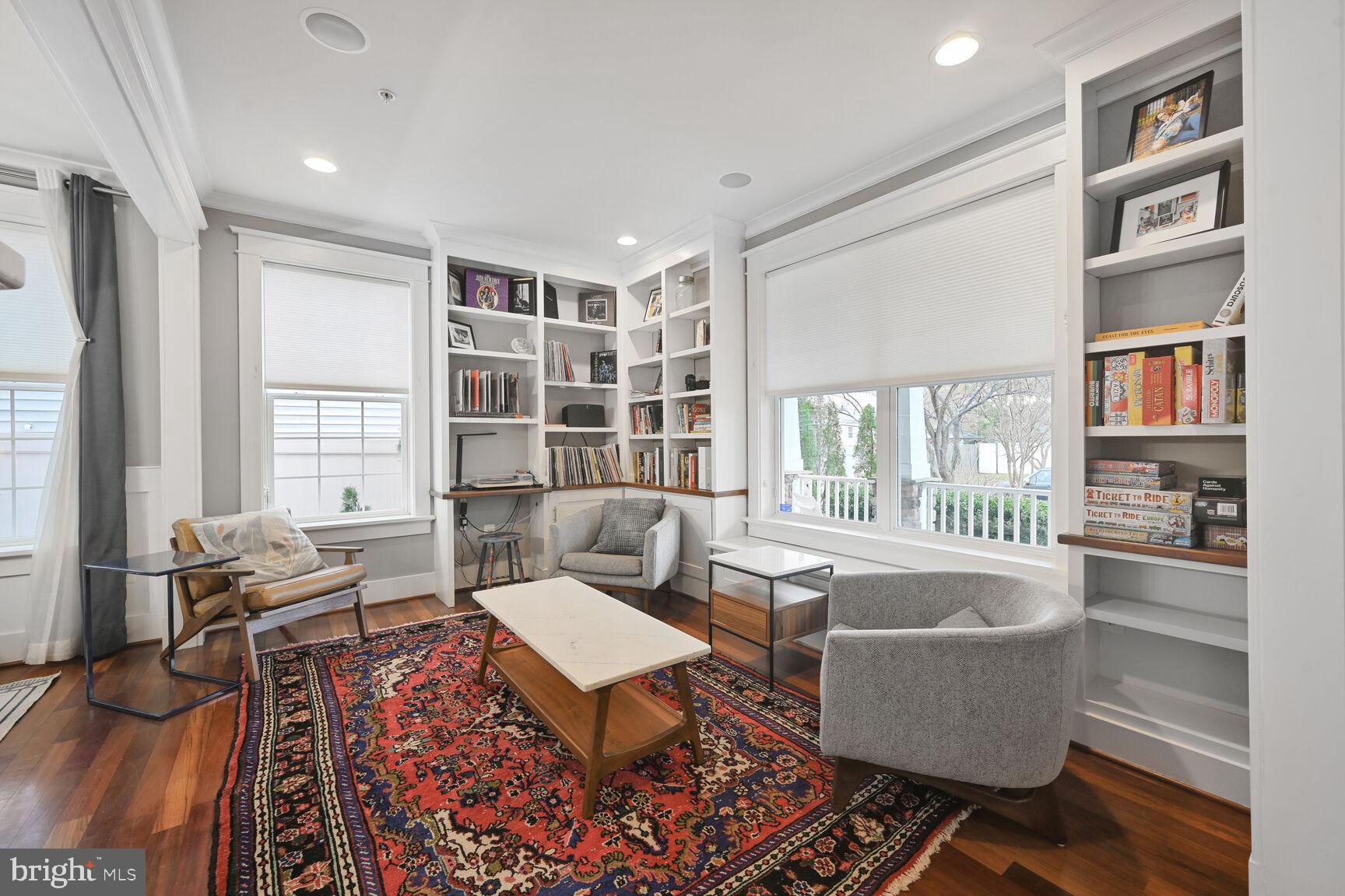 2107 Ellis Street Silver Spring, MD 20910 - Photo 7 of 63 a living room with furniture a bookshelf and a window