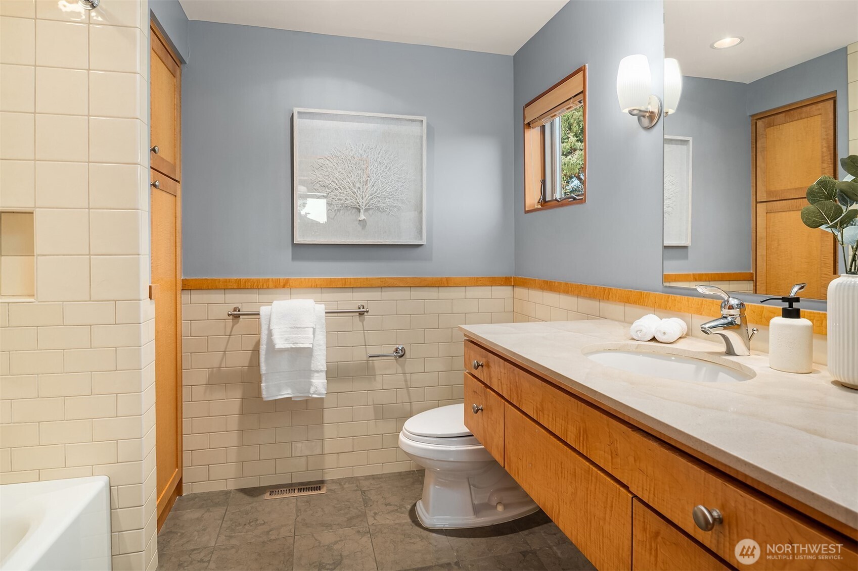 2252 Viewmont Way West Seattle, WA 98199 - Photo 19 of 40 a bathroom with a granite countertop sink a toilet and shower