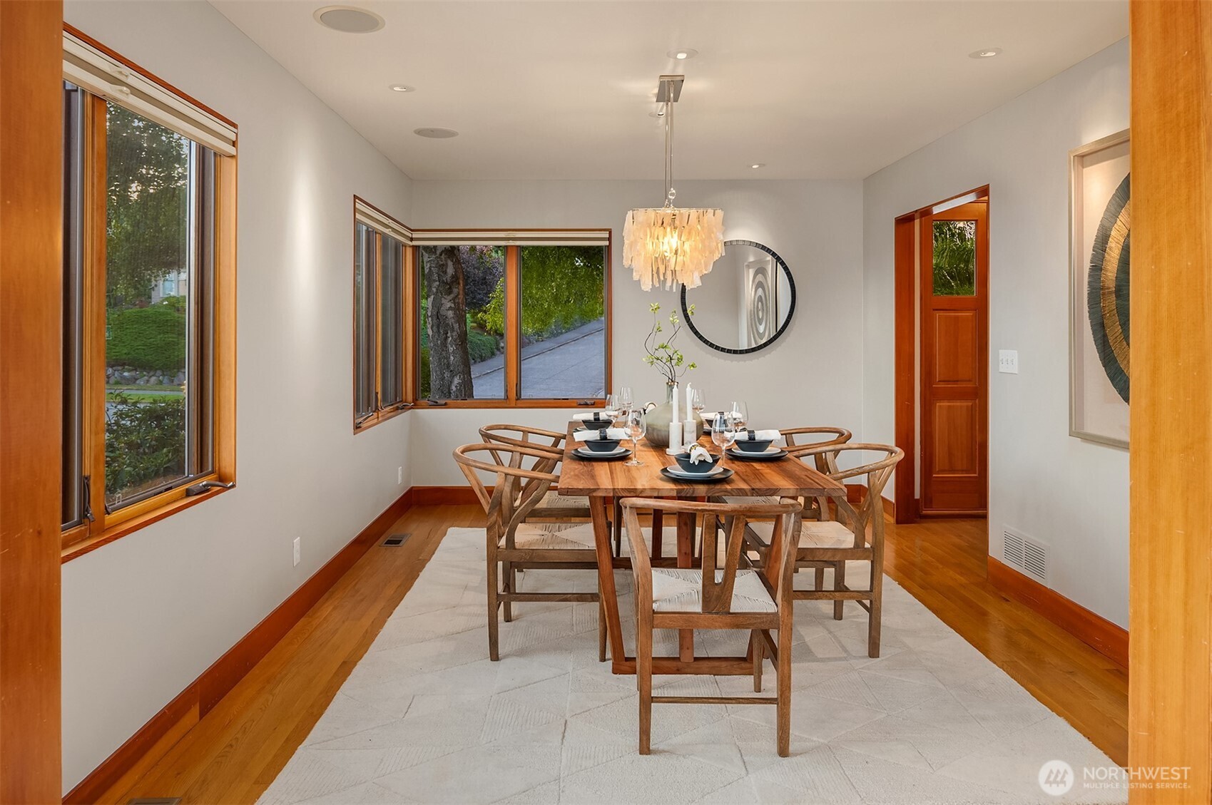 2252 Viewmont Way West Seattle, WA 98199 - Photo 6 of 40 a view of a dining room with furniture wooden floor and a rug