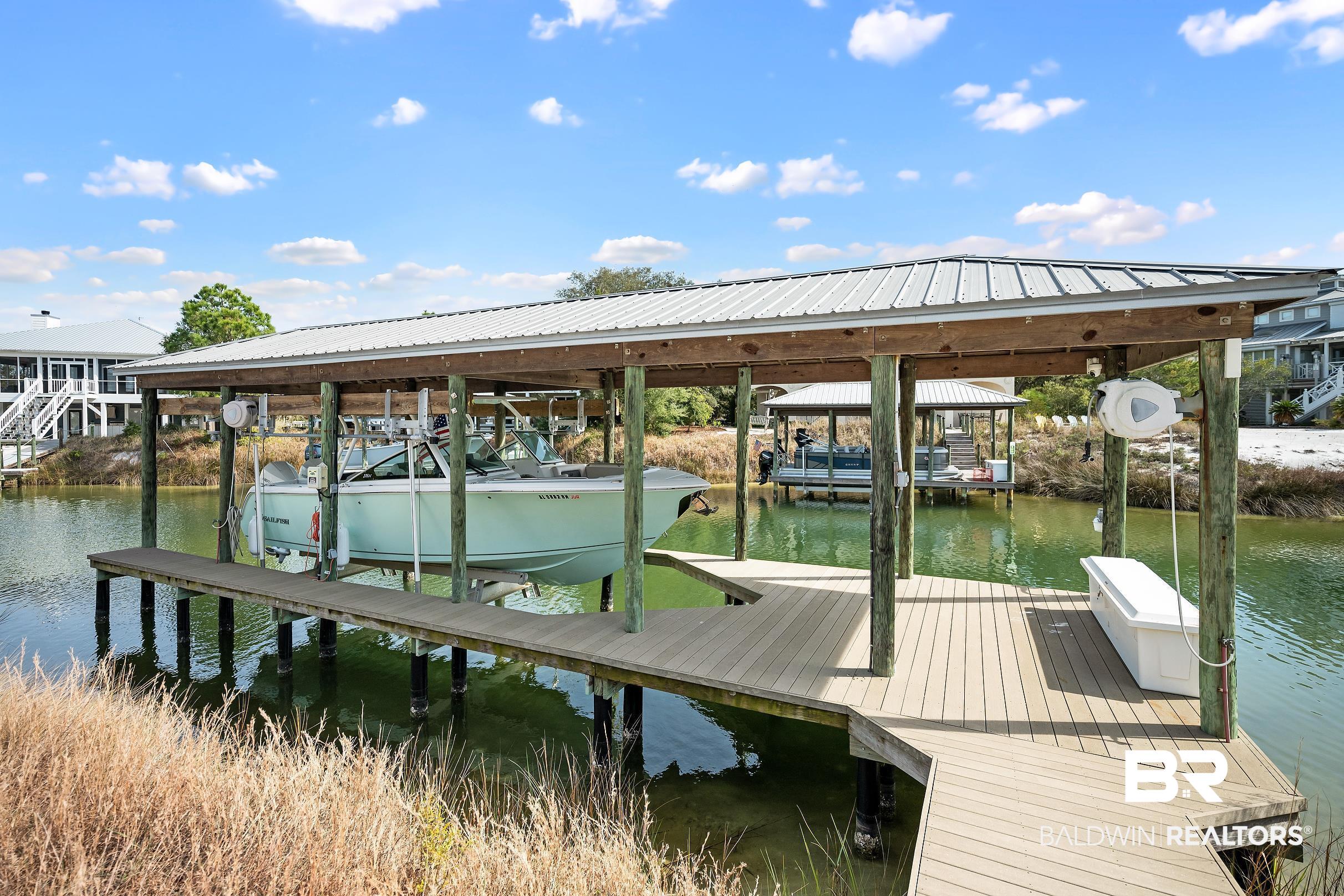 33186 Marlin Key Drive Orange Beach, AL 36561 - Photo 19 of 87 Dock with boat lift and a water view