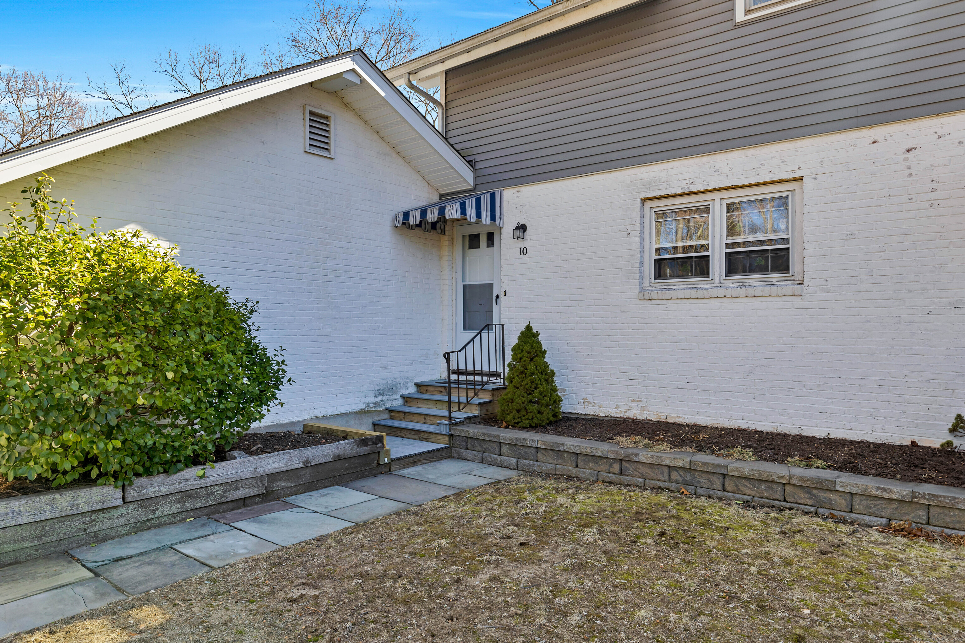 15 Sunset Terrace, Unit 10 Essex, CT 06426 - Photo 1 of 18 a house with trees in front of it